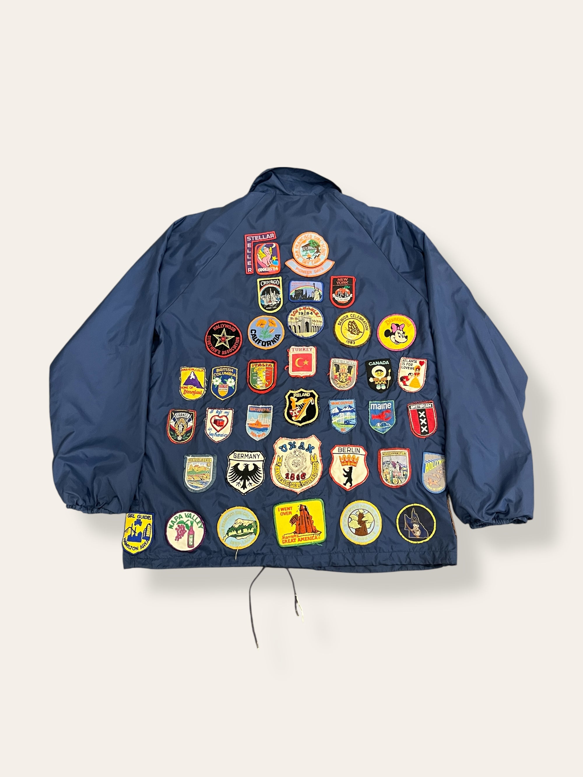 Vintage 1970’s Travel Patched Nylon Jacket