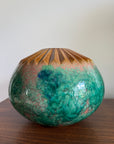 Decorative ceramic vase with green and brown glaze on a wooden surface mcm pottery statement bowl